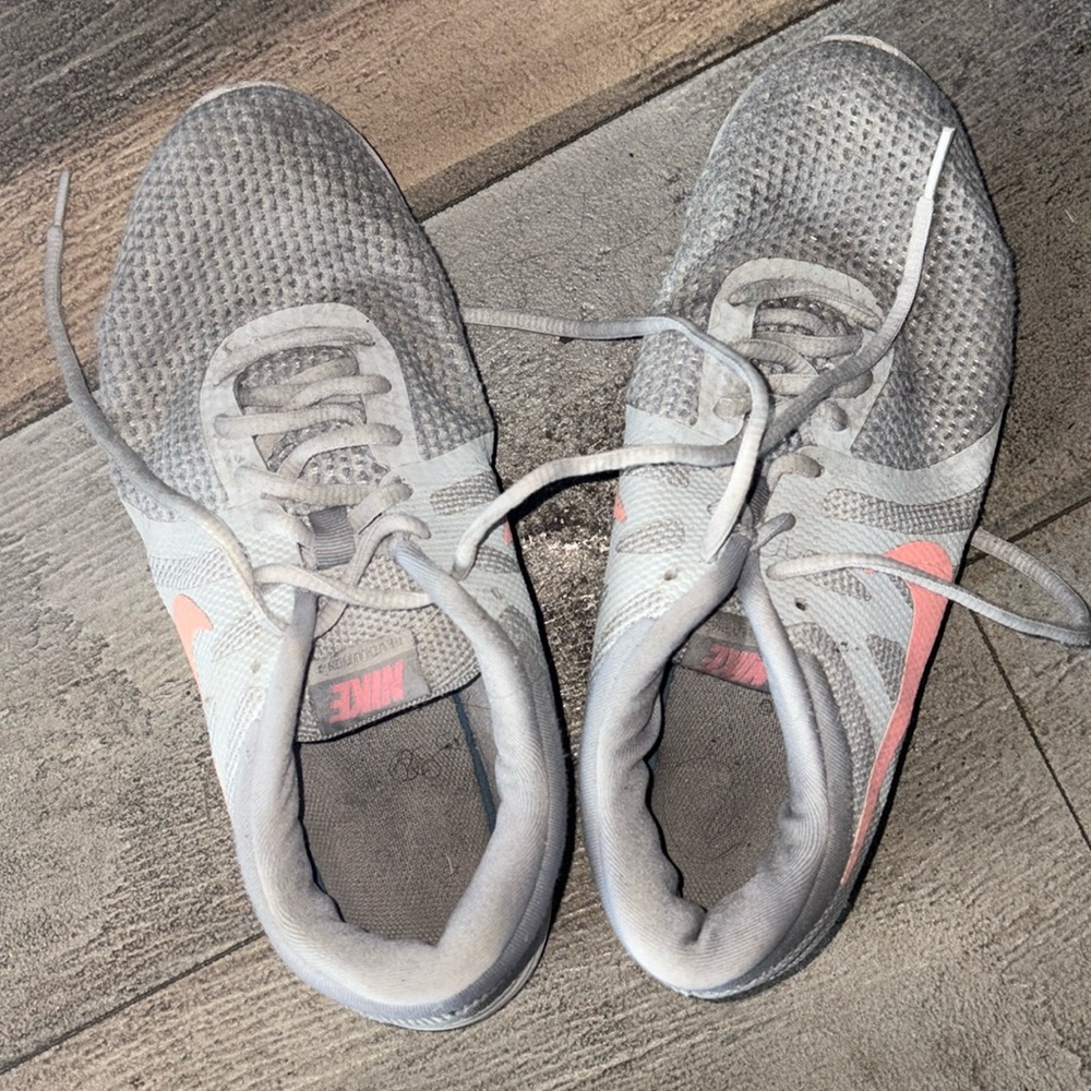 size 9 women’s gray and pink nikes 
need cleaned